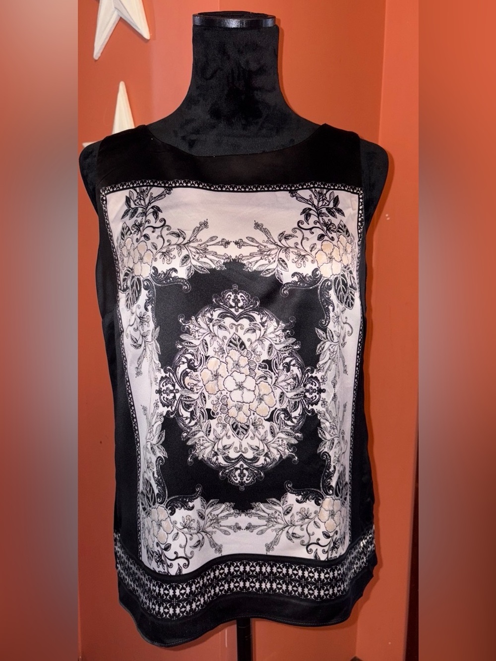 212 Collection black and white top with ivory floral accent